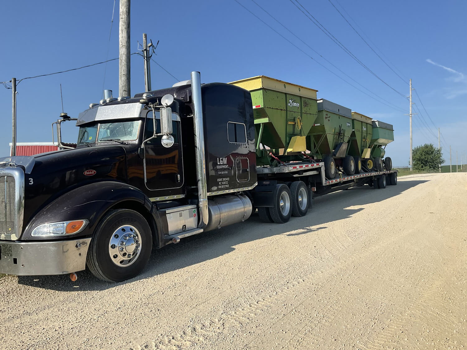 Semi with grain bins on trailer bed