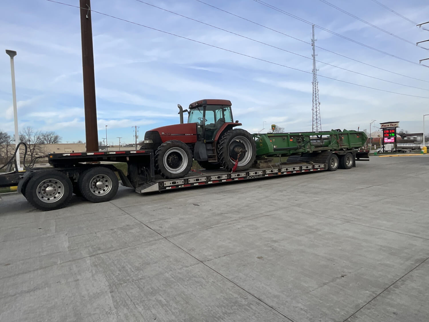 Red Tractor on trailer bed