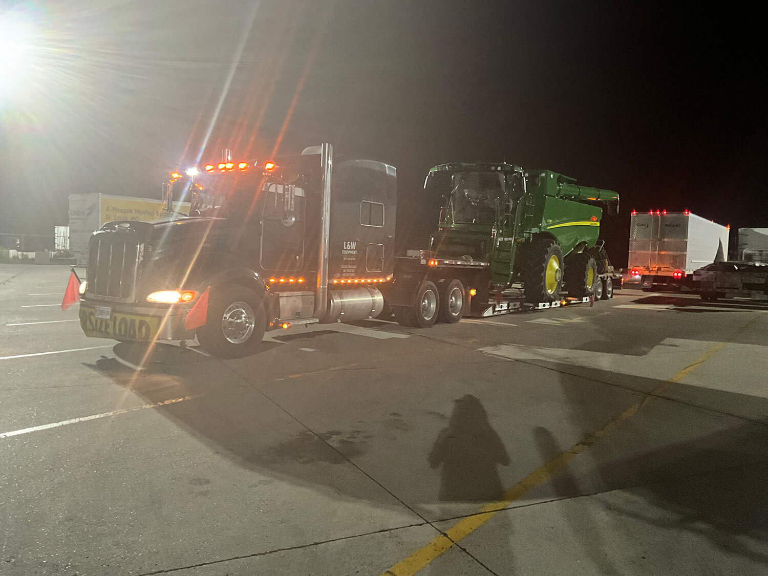 Semi Hauling John Deere Combine