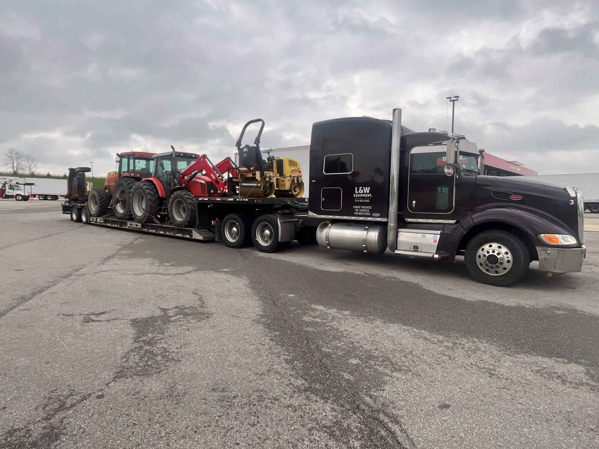 Truck hauling ag equipment
